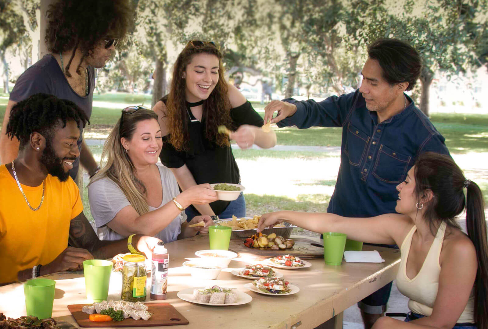 A group of young people enjoying MegaMex in a park