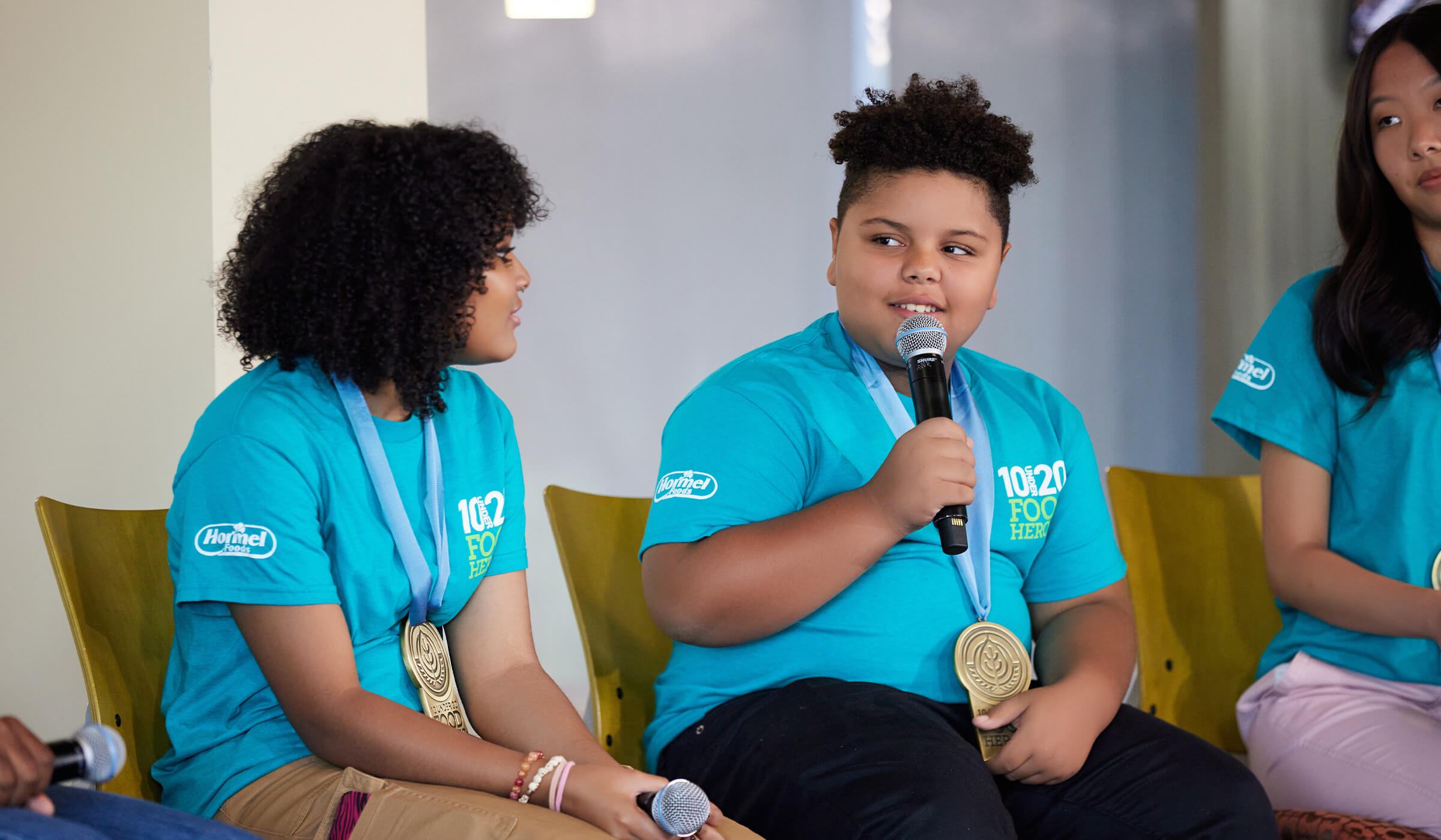 2023 10 Under 20 Food Hero Cavanaugh Bell speaking at a panel discussion in Austin MN