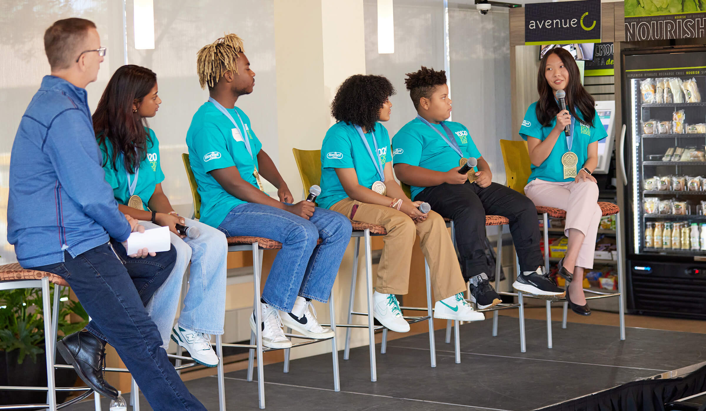 A photo of the 2023 10 Under 20 Food Hero winners speaking at a panel.