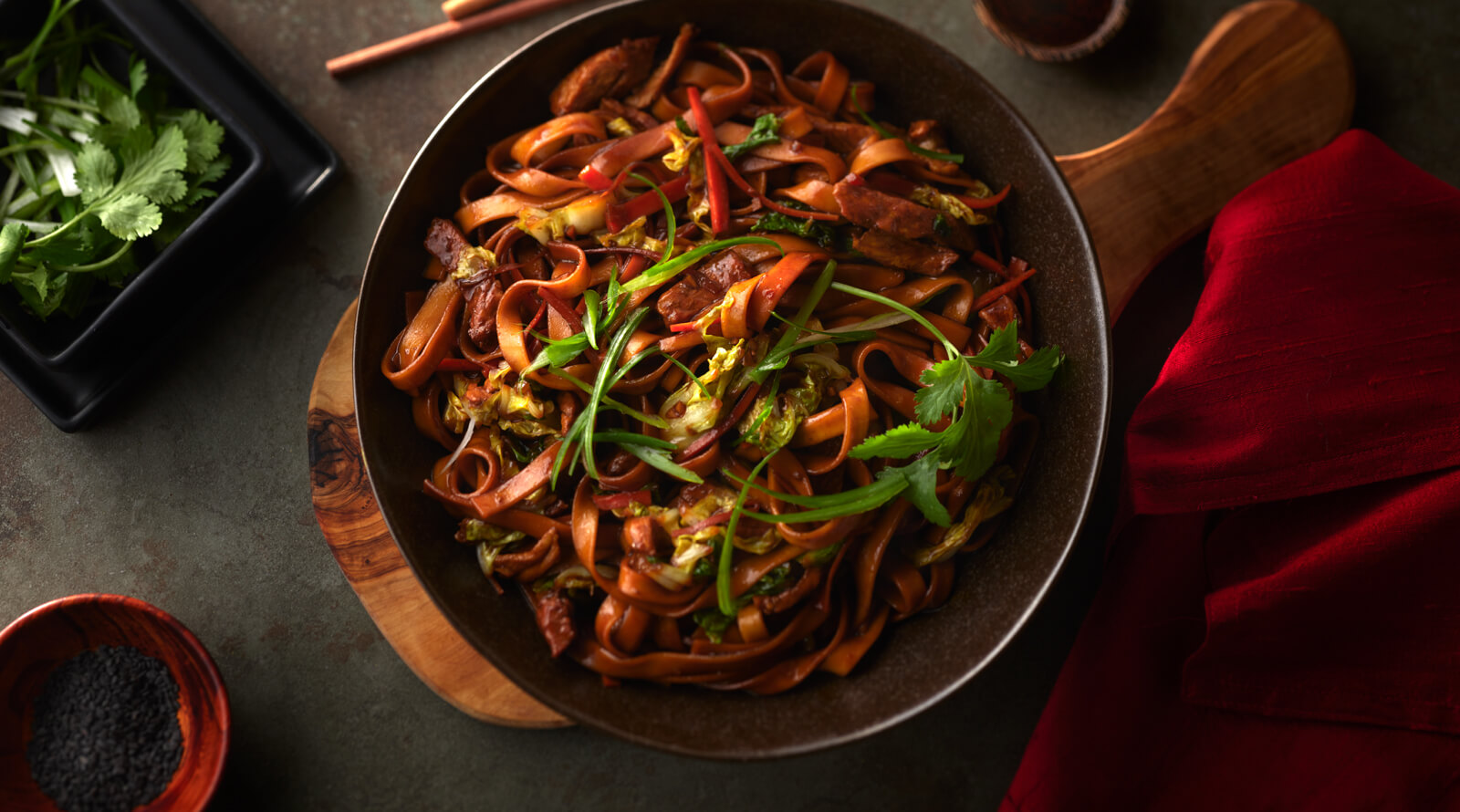 bowl of pork lo mein shot from above