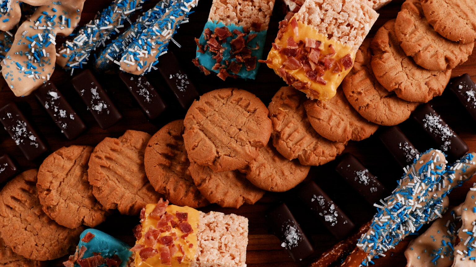 Dessert Board with Peanut Butter cookies, crispy rice treats and chocolate dipped pretzels.