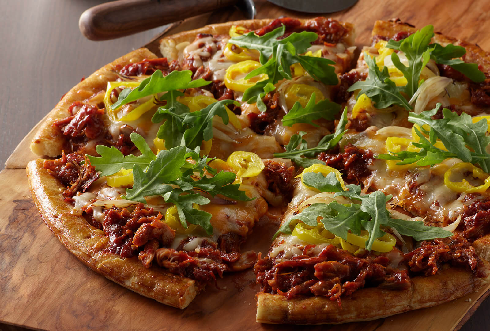 LLOYD’S® Pig Beach BBQ Chicken Pizza with Arugula, Shallot & Banana Peppers