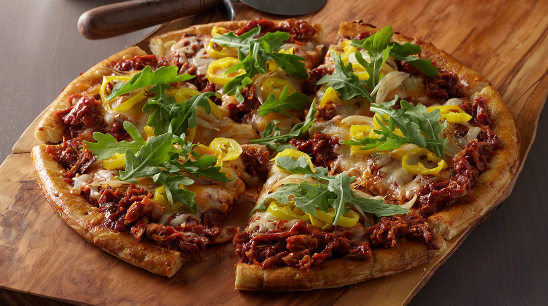 LLOYD’S® Pig Beach BBQ Chicken Pizza with Arugula, Shallot & Banana Peppers