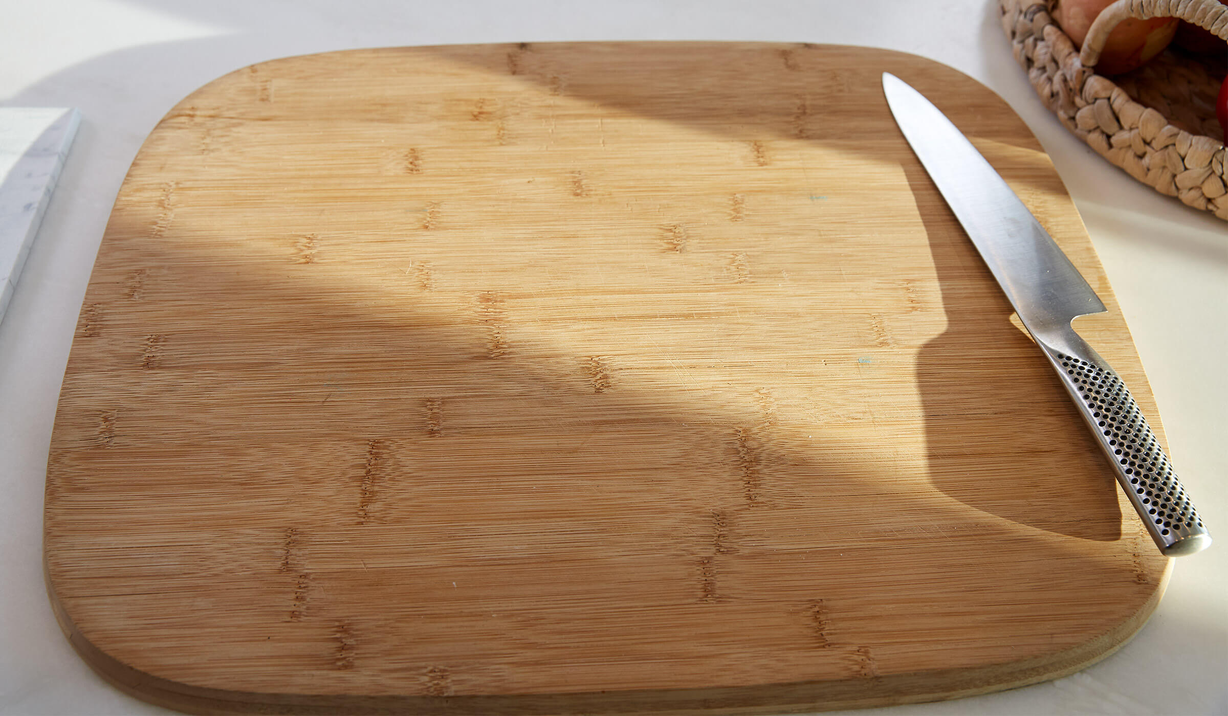 Wooden cutting board with a knife