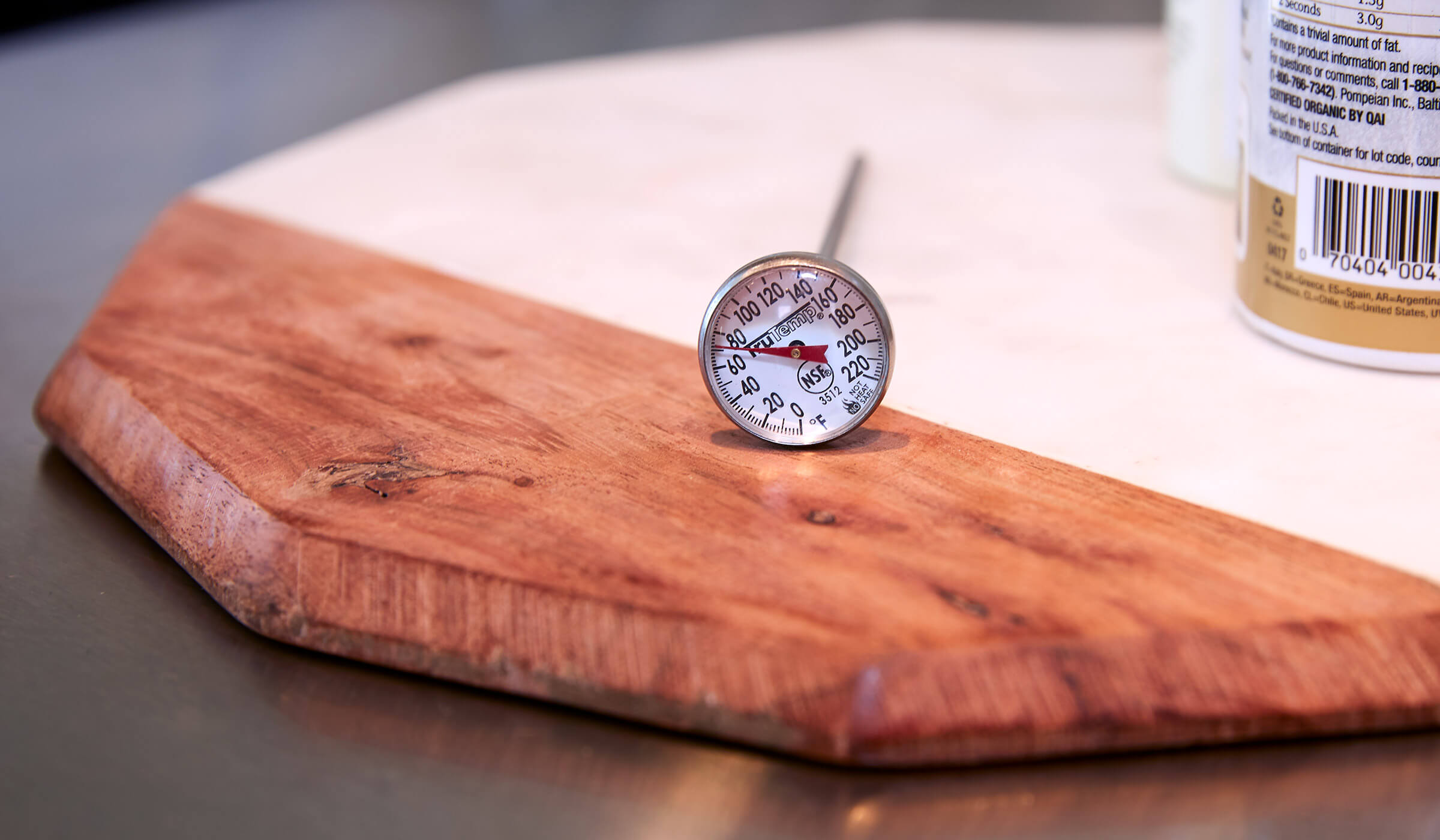 Wooden cutting board with meat thermometer