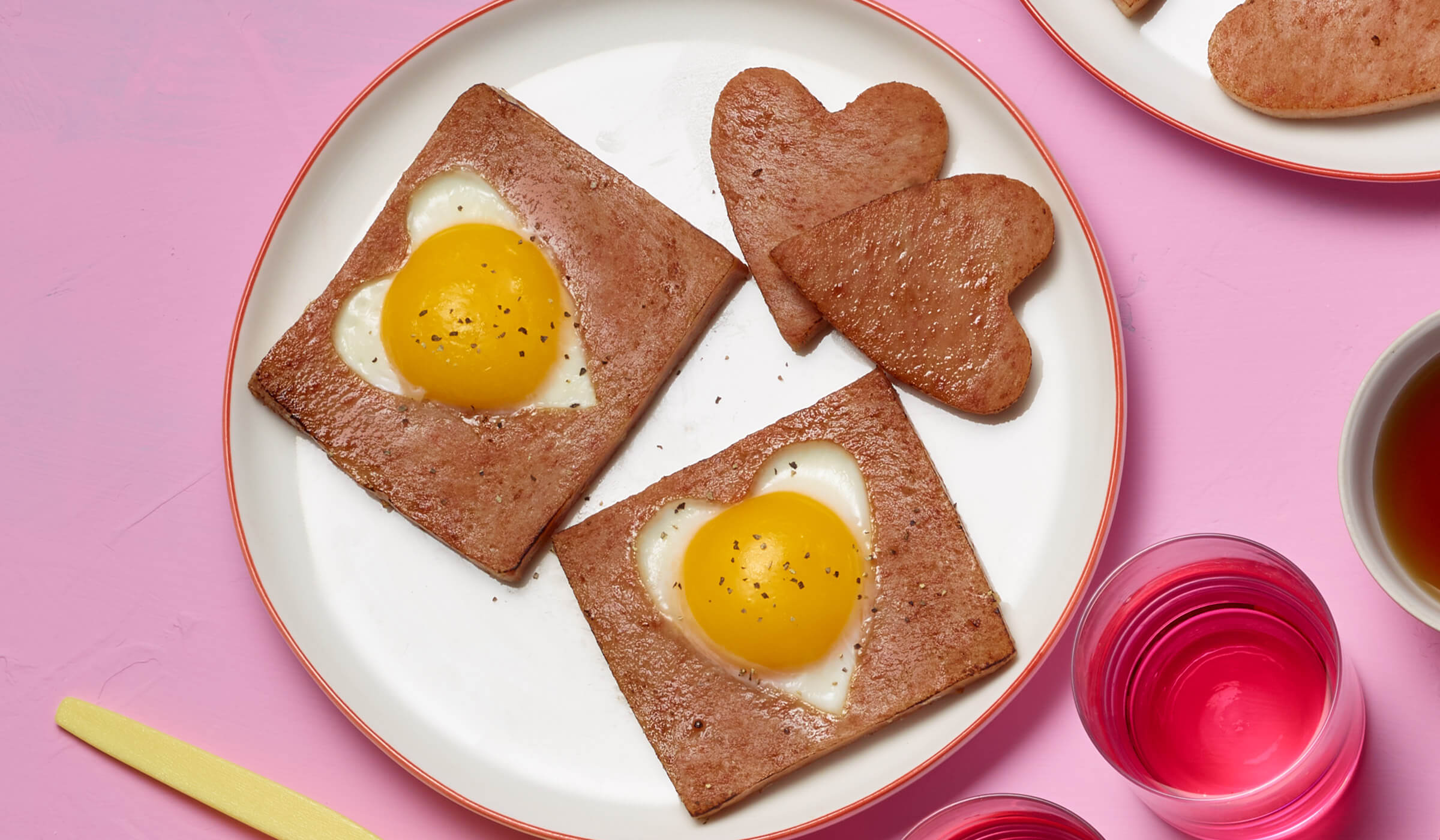 SPAM slices with eggs in the shape of hearts