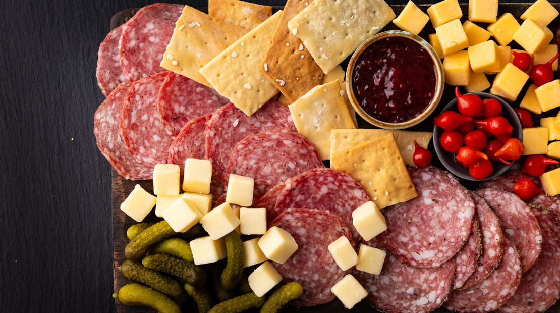 A COLUMBUS® Entertaining Tray on a black countertop.