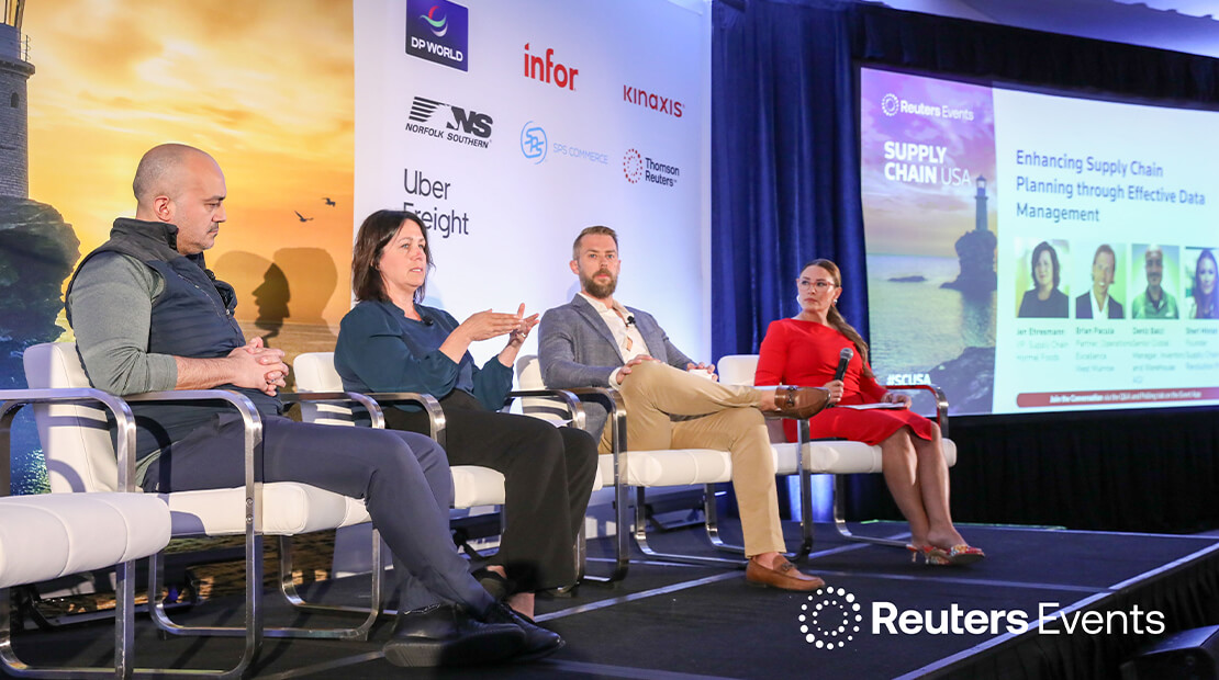 Jen Ehresmann sitting in a white chair with three other people in a panel discussion.