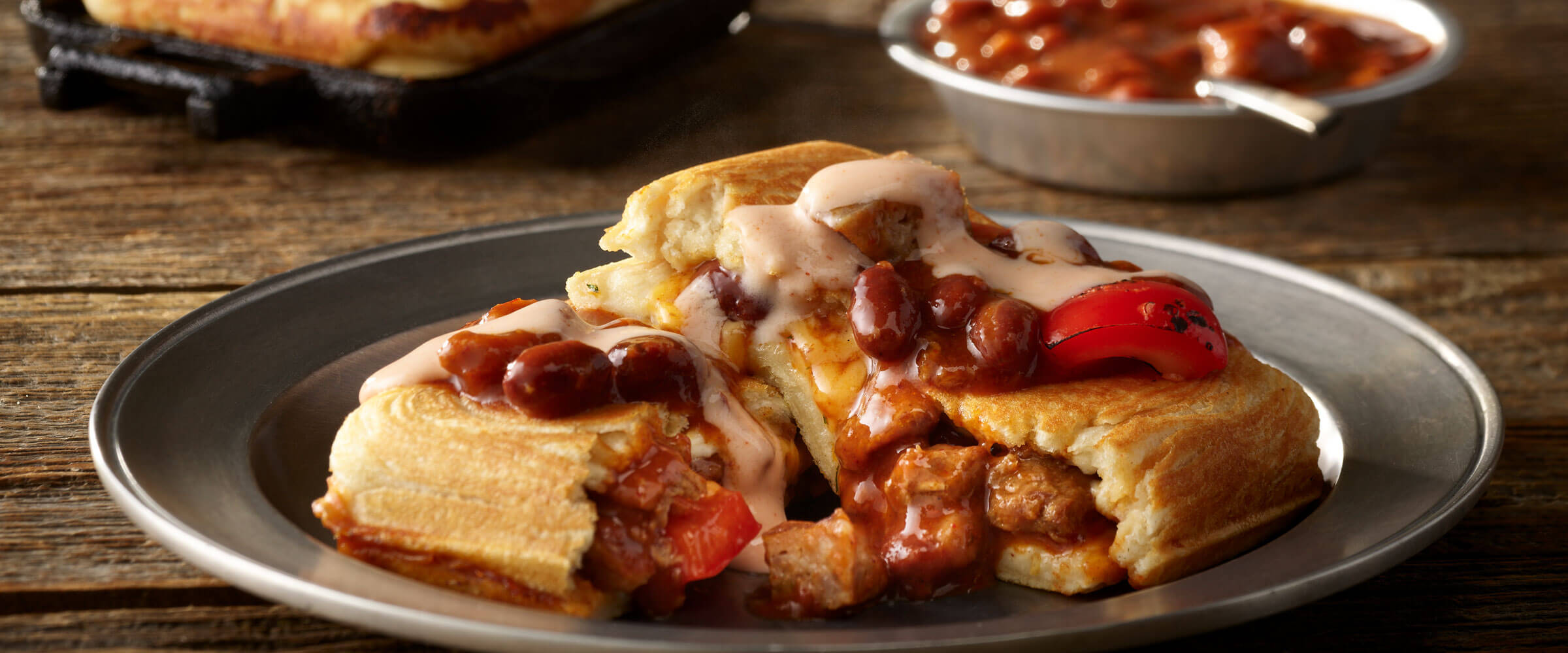 Italian Campfire Chili Pockets with Cheesy Sriracha Sauce