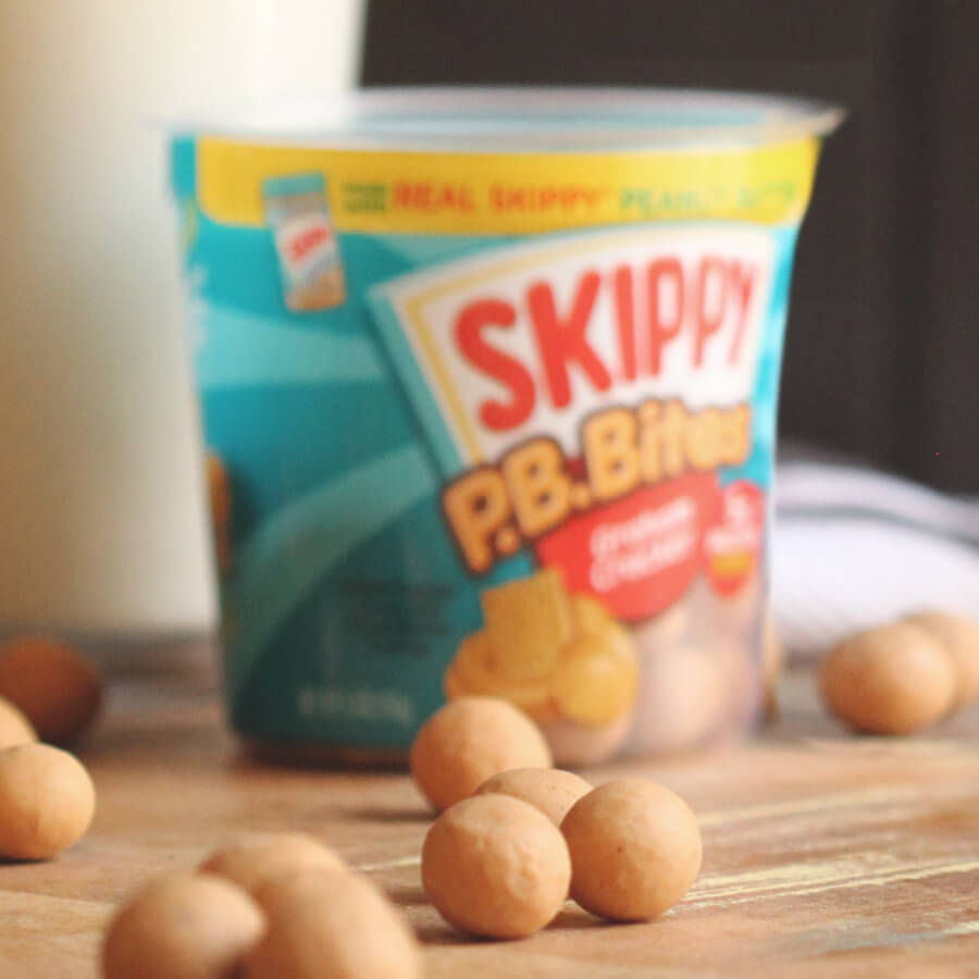 Skippy PB Bites on a table as if they jumped out of the container