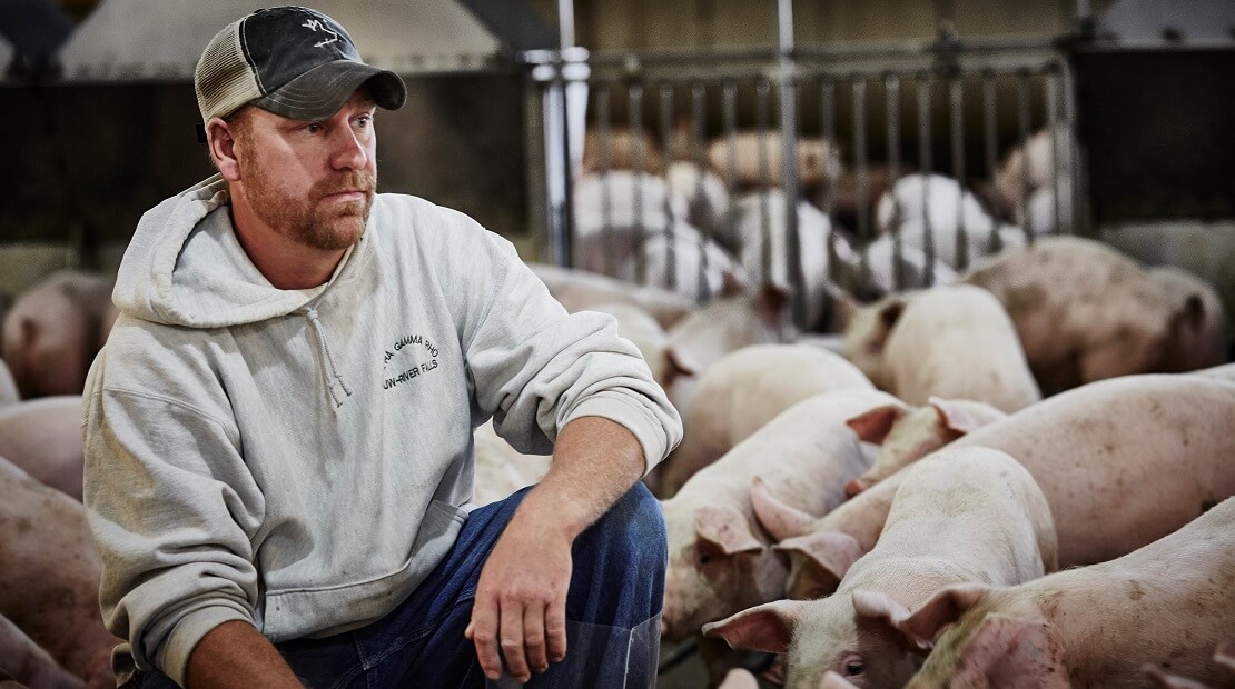 Farmer with Hog