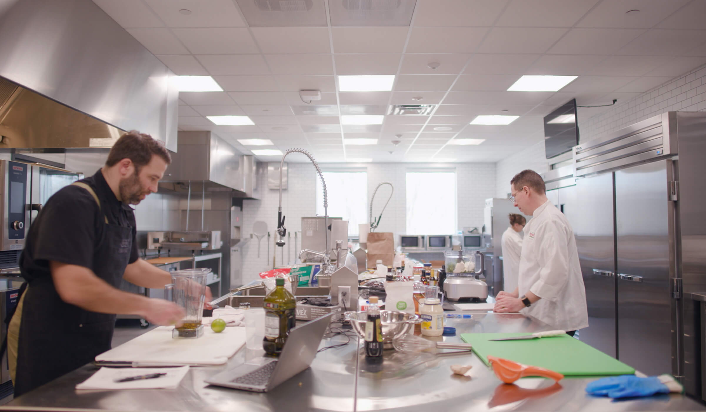 Chefs preparing food in the new Austin innovation center kitchen