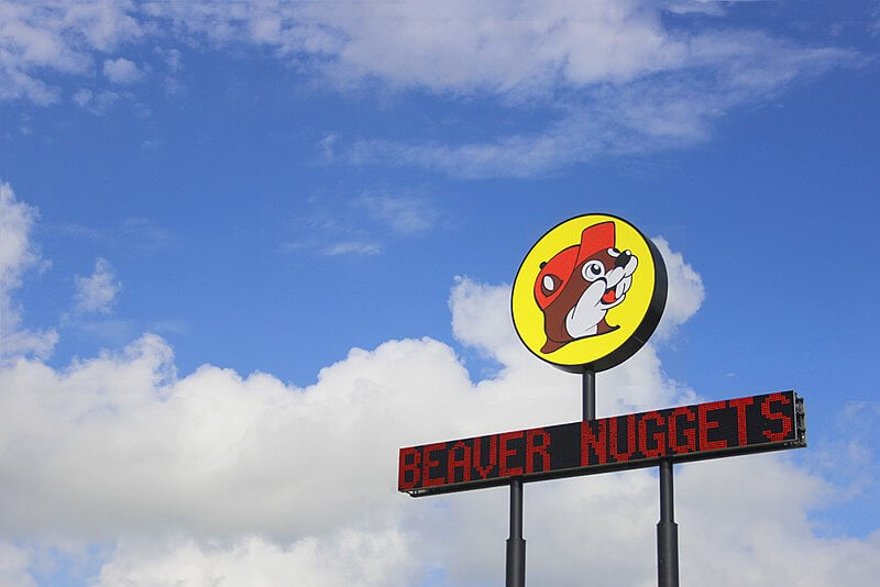 A Buc ee's sign on the road