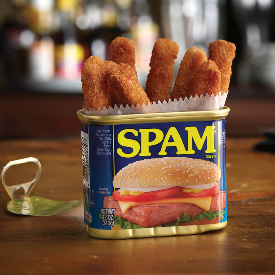 breaded SPAM fries placed vertically in a SPAM can