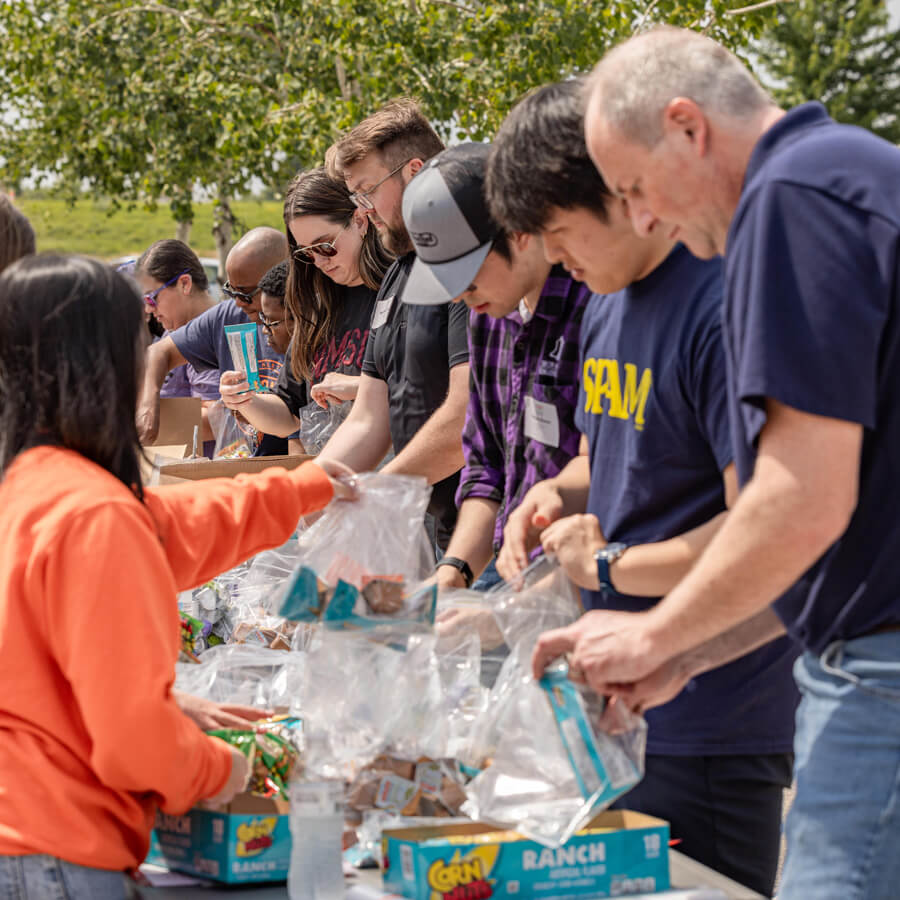 group packing donations at Hormel headquarters food donation event