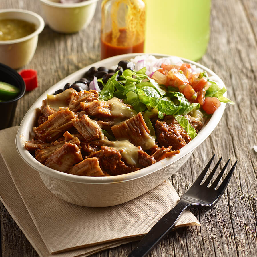 Bowl of Barbacoa with fork on Wooden table