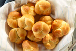 A basket full of cloverleaf rolls