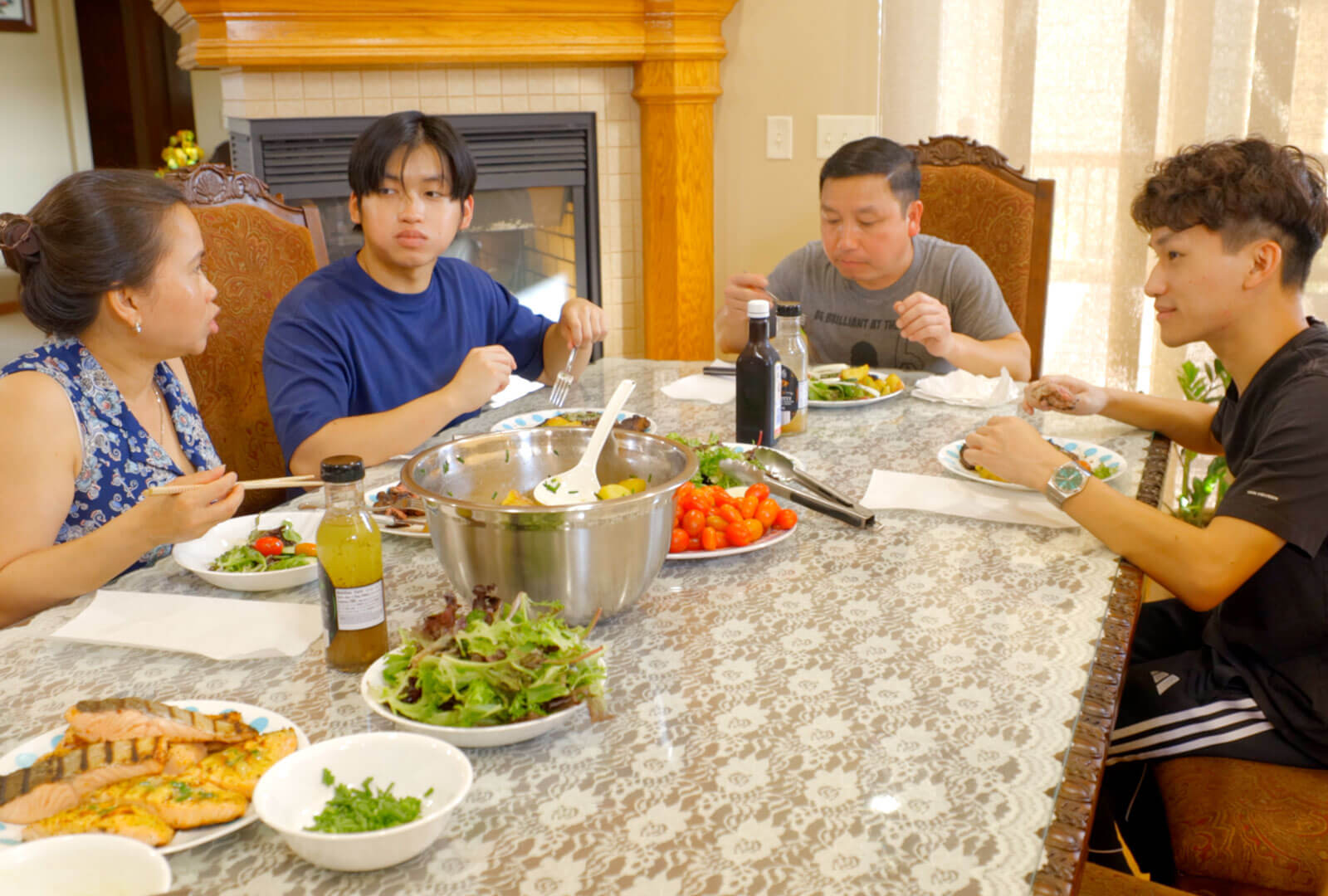 The Dang family sitting around their table for dinner