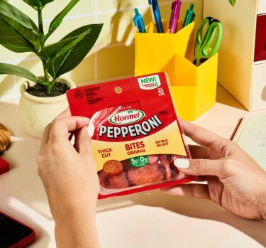 HORMEL<sup>®</sup> Pepperoni Snack Bites on desk