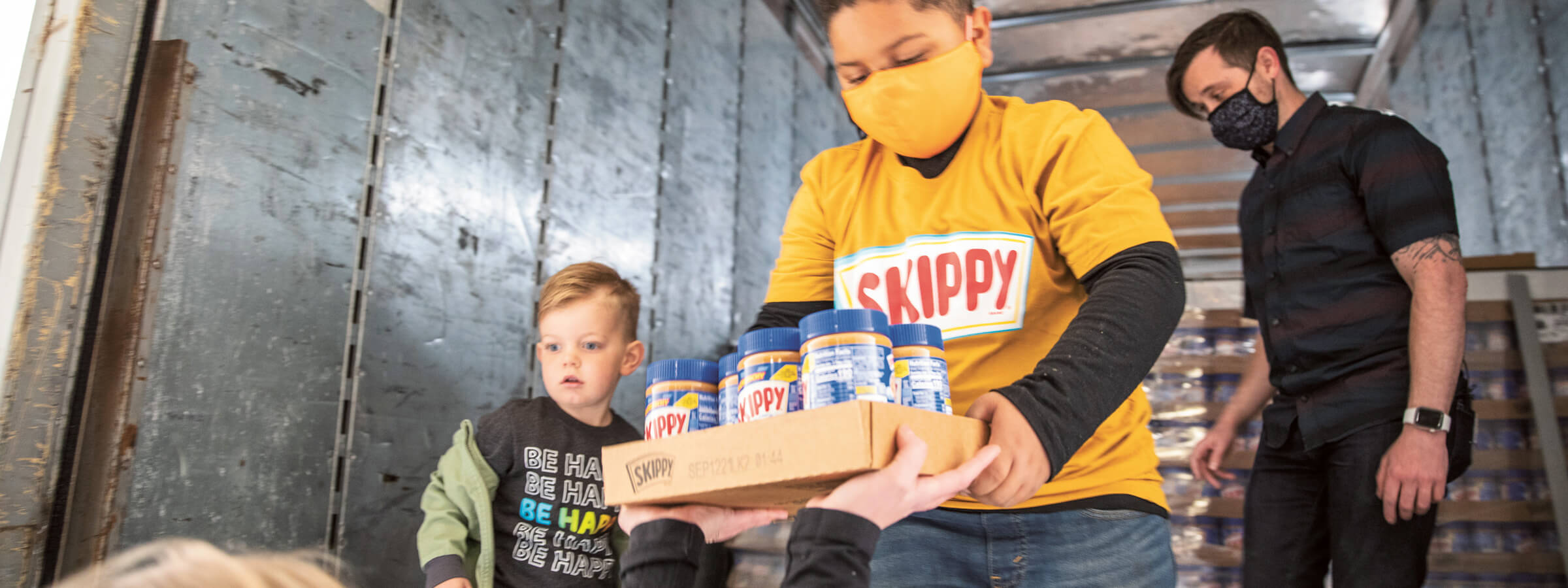 unloading Skippy products from a food donation truck
