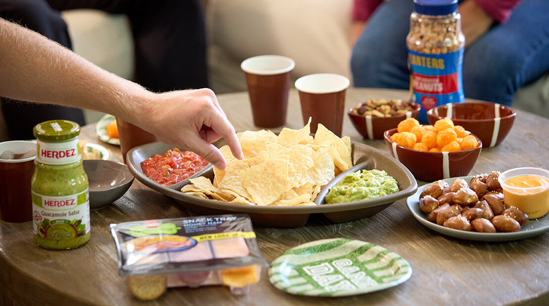 Table with various snacks in bowls