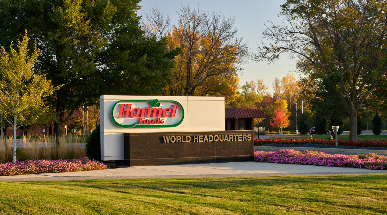 Hormel Foods headquarters sign with fall foliage
