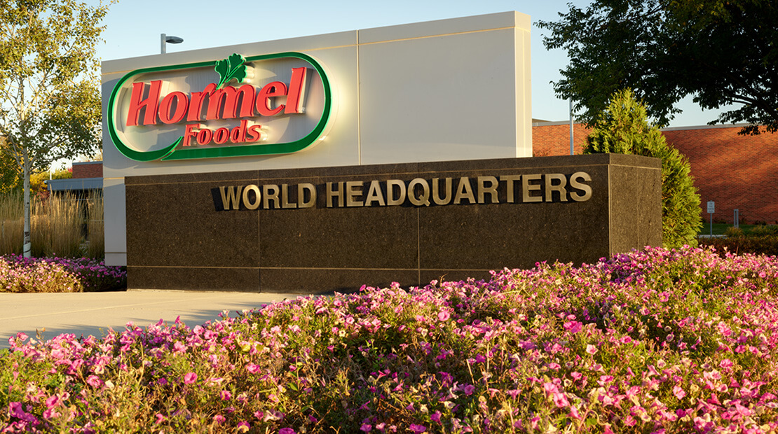 Hormel Foods headquarters sign with pink flowers