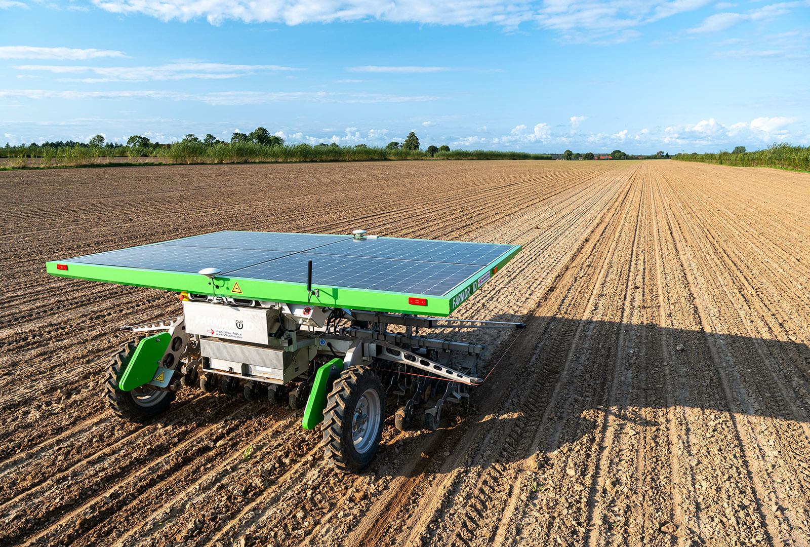 An autonomous, AI-powered seeding / weeding drone working on a farm