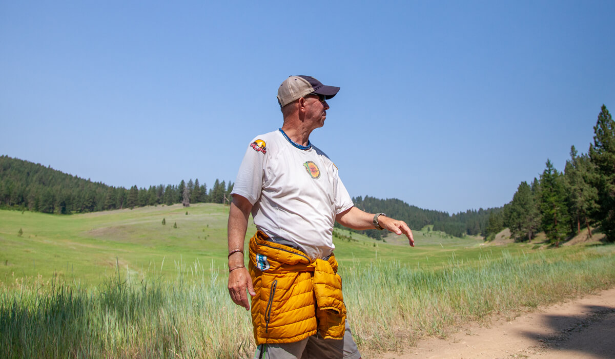 Kenneth Perry standing in a field