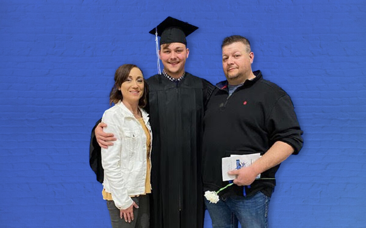 MacCoy, his father Jason and his mother Kimberly at his high school graduation