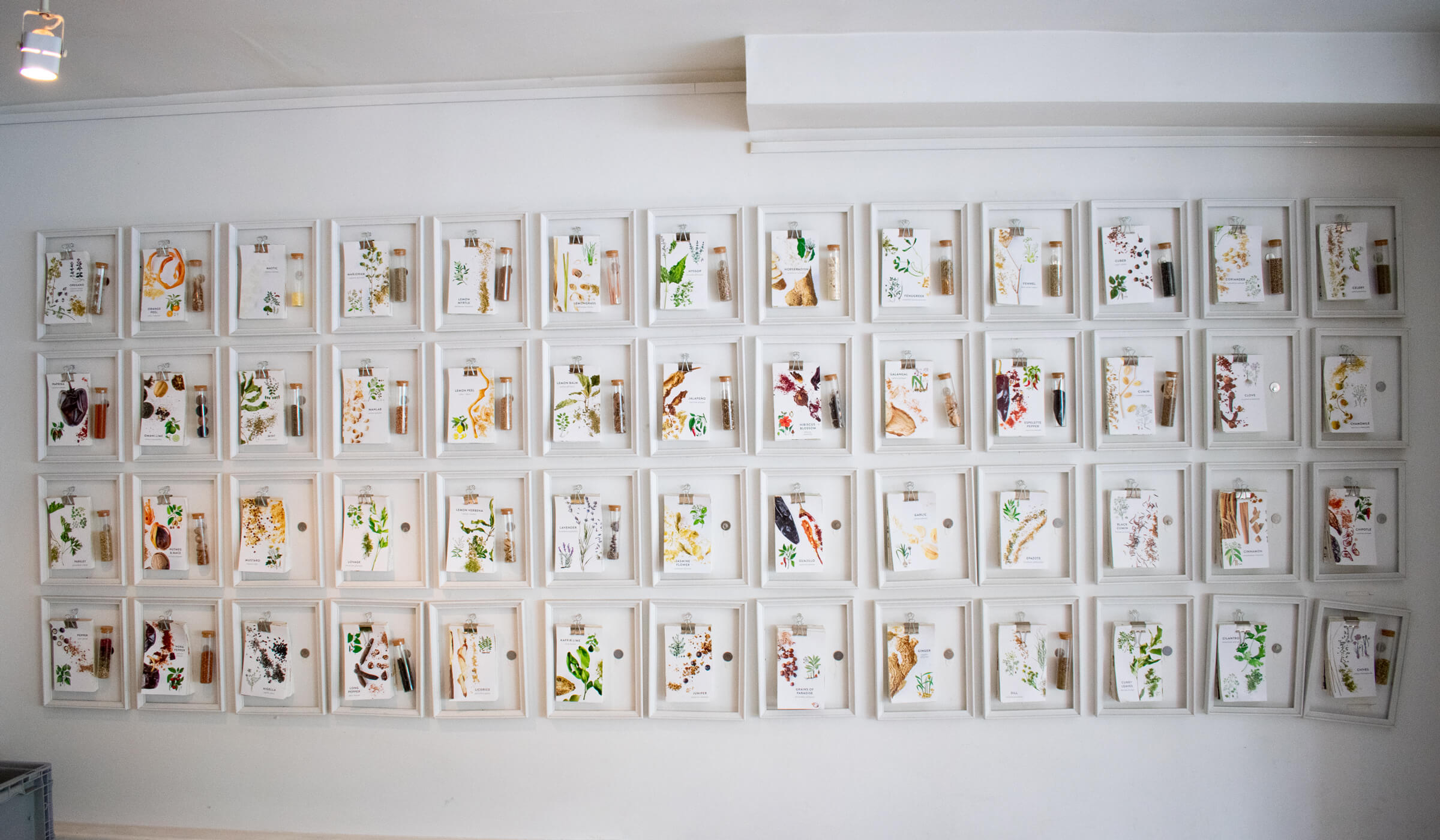 Wall of hand outs about spices at La Boite in New York City